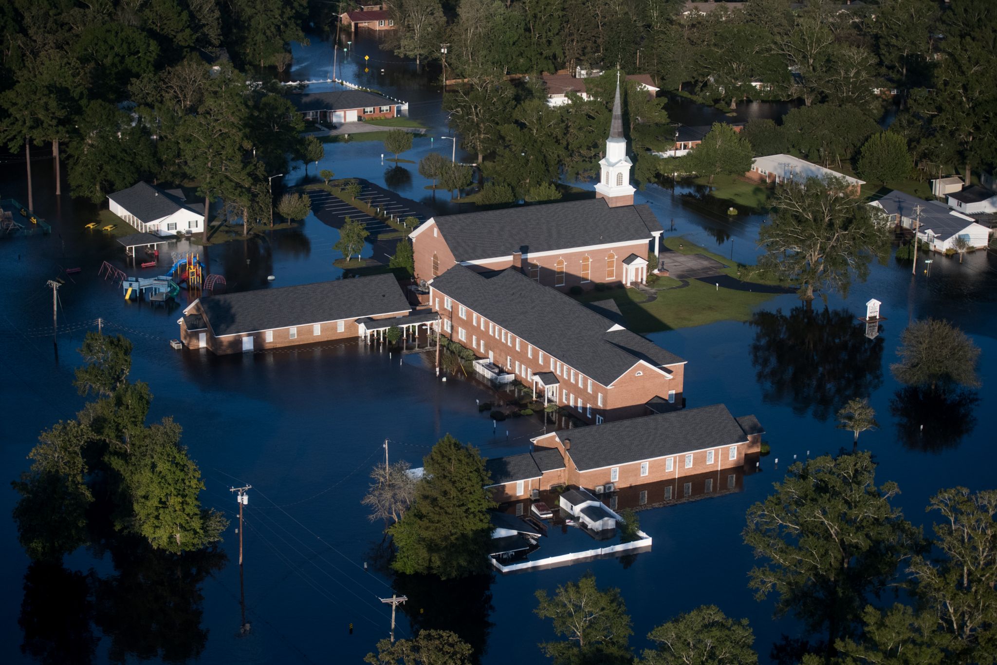 a church in the midst of a flooded town