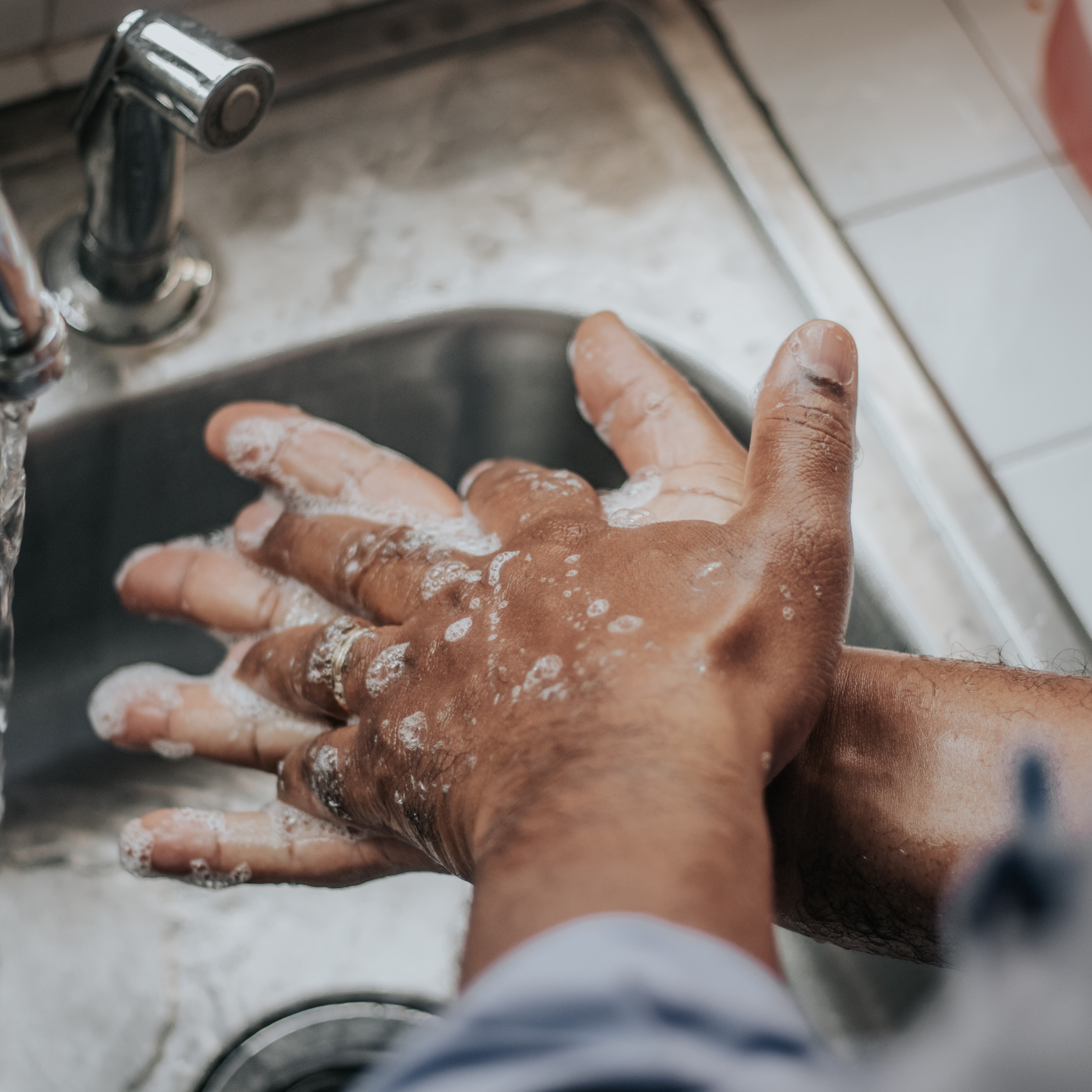 person washing their hands