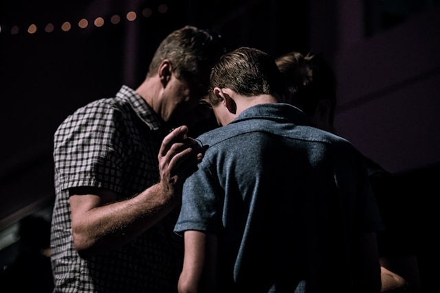 two men praying together