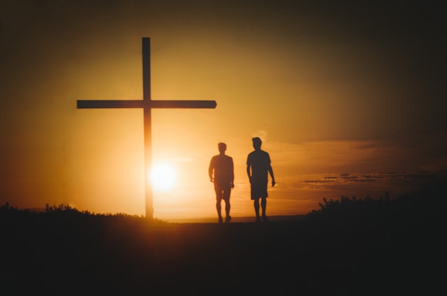 two people walking in light